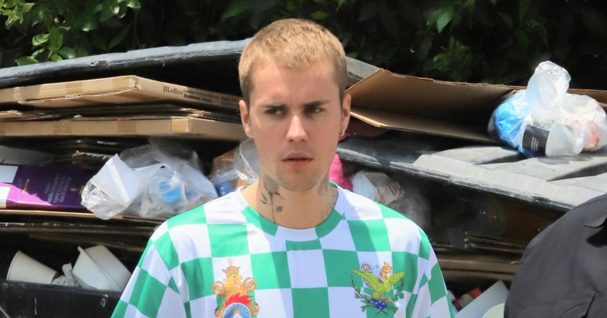 justin bieber demands  million off woman pp