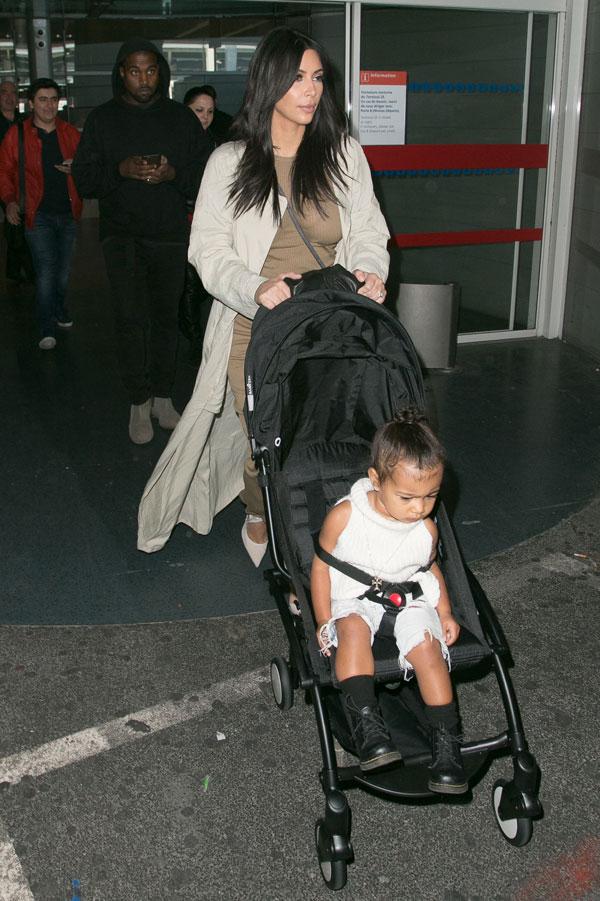 Kim Kardashian Kanye North West Photos -- Toddler Smiles As Family Arrives In Paris