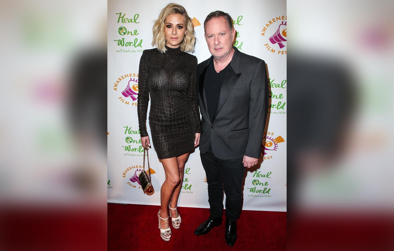 Paul Kemsley Wearing a Suit and Dorit Kemsley Wearing a Snake Skin Dress Pose On The Red Carpet Looking Serious