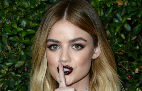 Lucy Hale arrived to a Pretty Little Liars in a skin-baring black bikini-type top with black slacks.