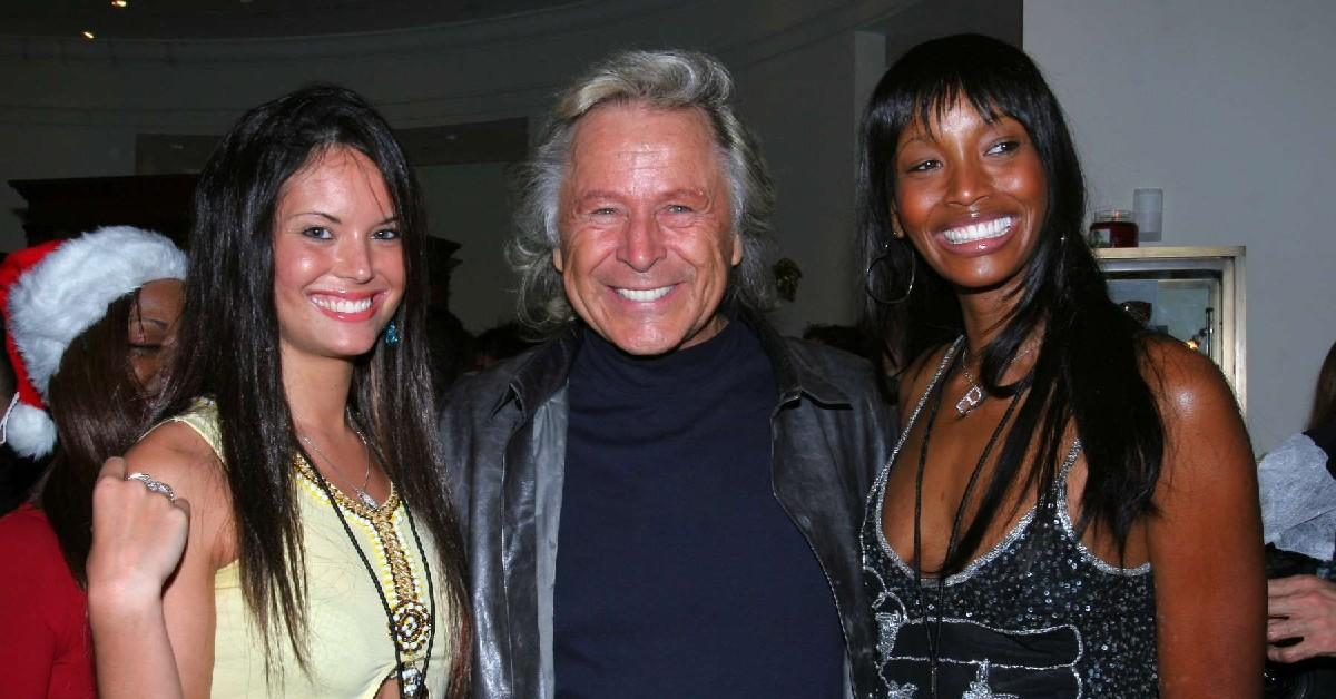 Peter Nygard pictured with two women in 2004.