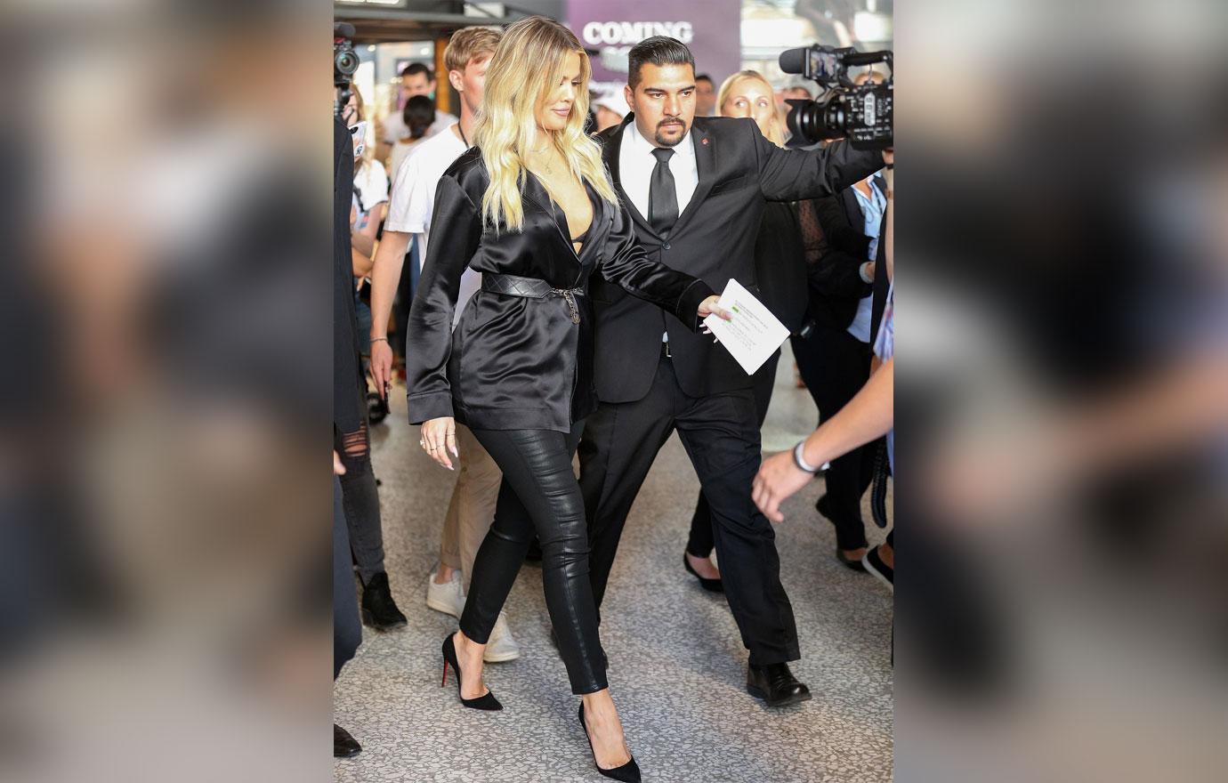 Pregnant Khloe Kardashian Covers Baby Bump During Promotional Appearance