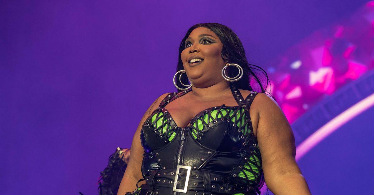 Lizzo's breast spill out as she flaunts her body in fur bikini (photos)