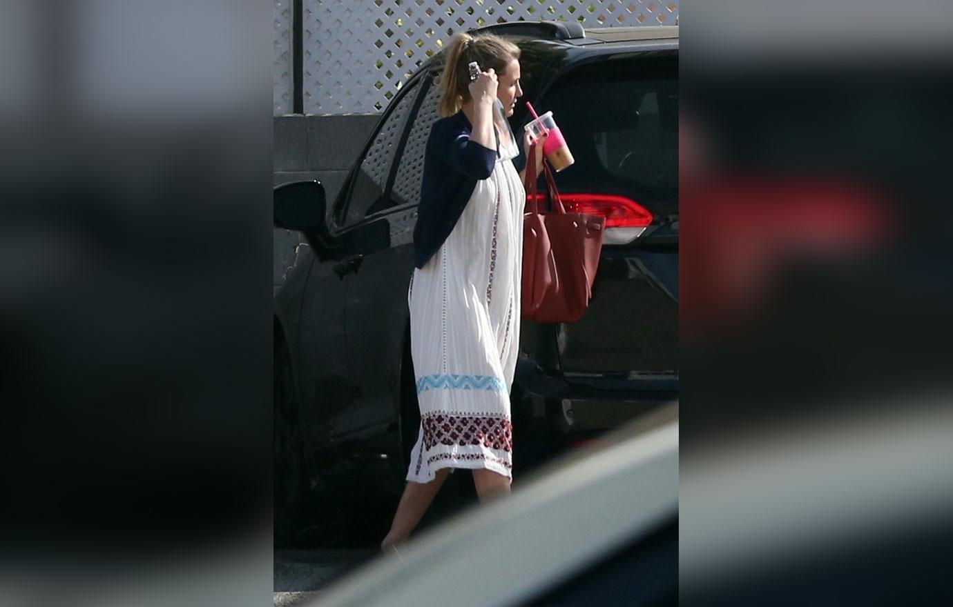 Cameron Diaz Desperately Trying To Hide Baby Bump In Grotesquely Oversized Clothes