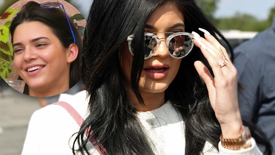 Modeling Fail! Watch Kylie Jenner Faceplant In The Sand During Photo ...