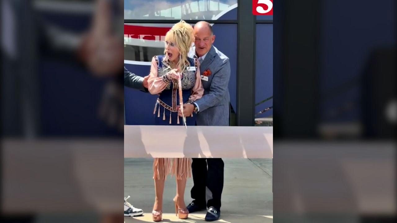The singer cut the ceremonial ribbon at the opening of her new Tennessee truck stop.
