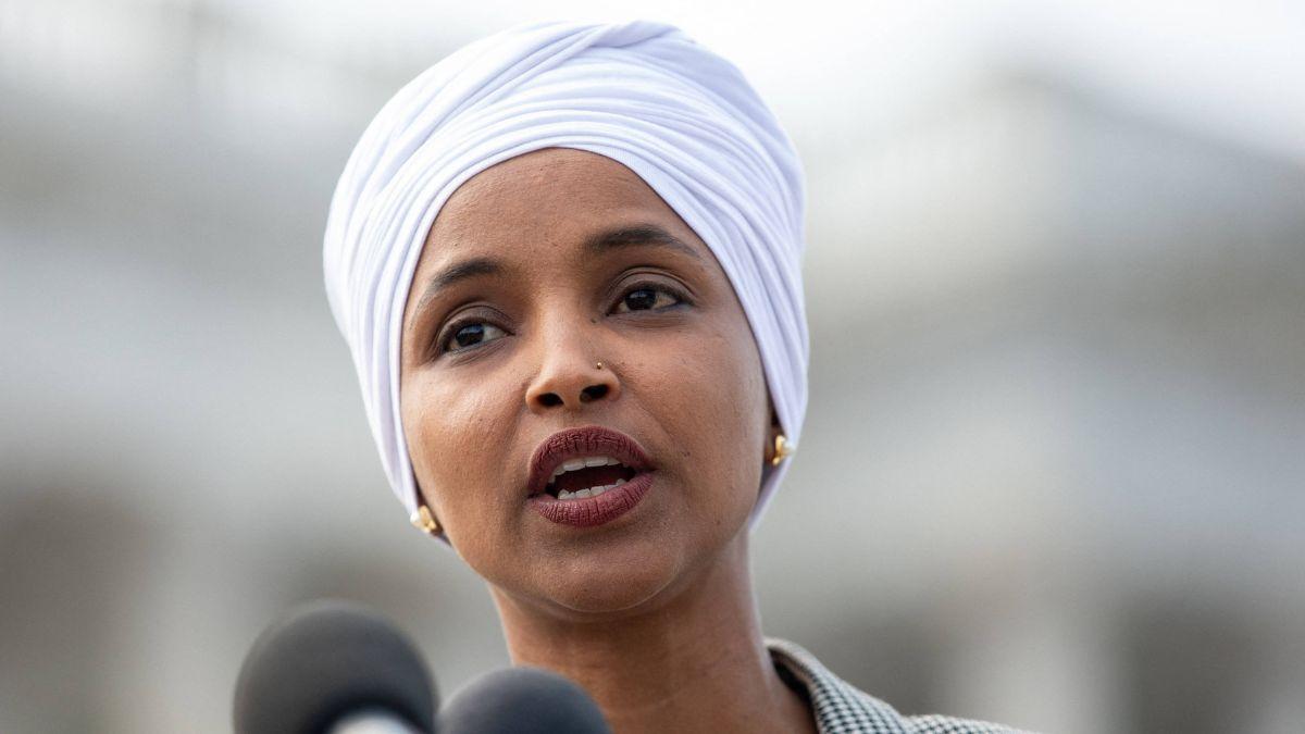 image of Omar stood her ground as chaos erupted and aides moved in to protect her.