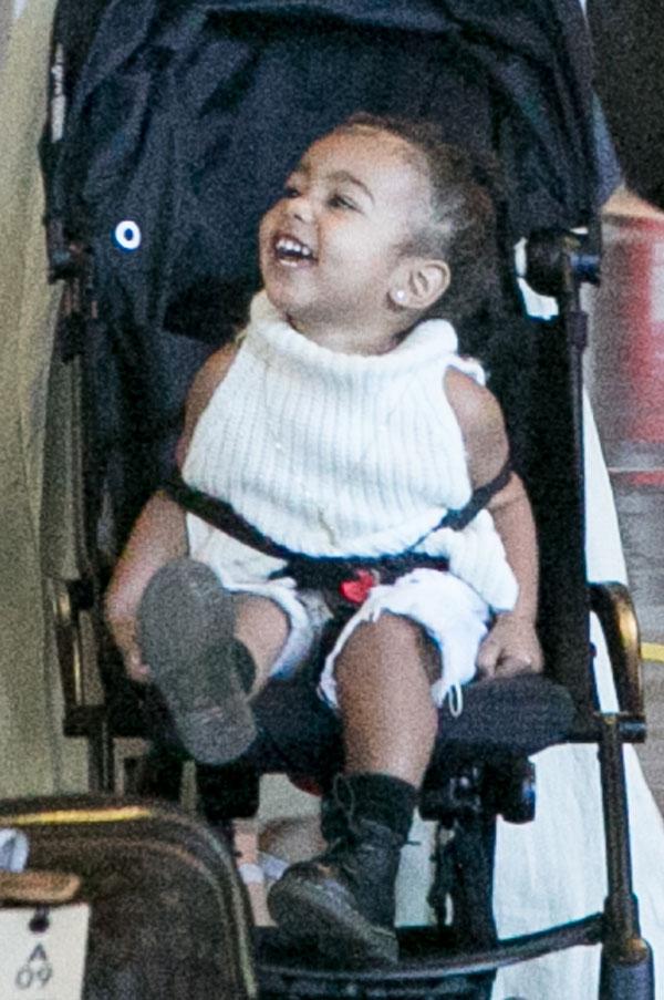 Kim Kardashian Kanye North West Photos -- Toddler Smiles As Family Arrives In Paris