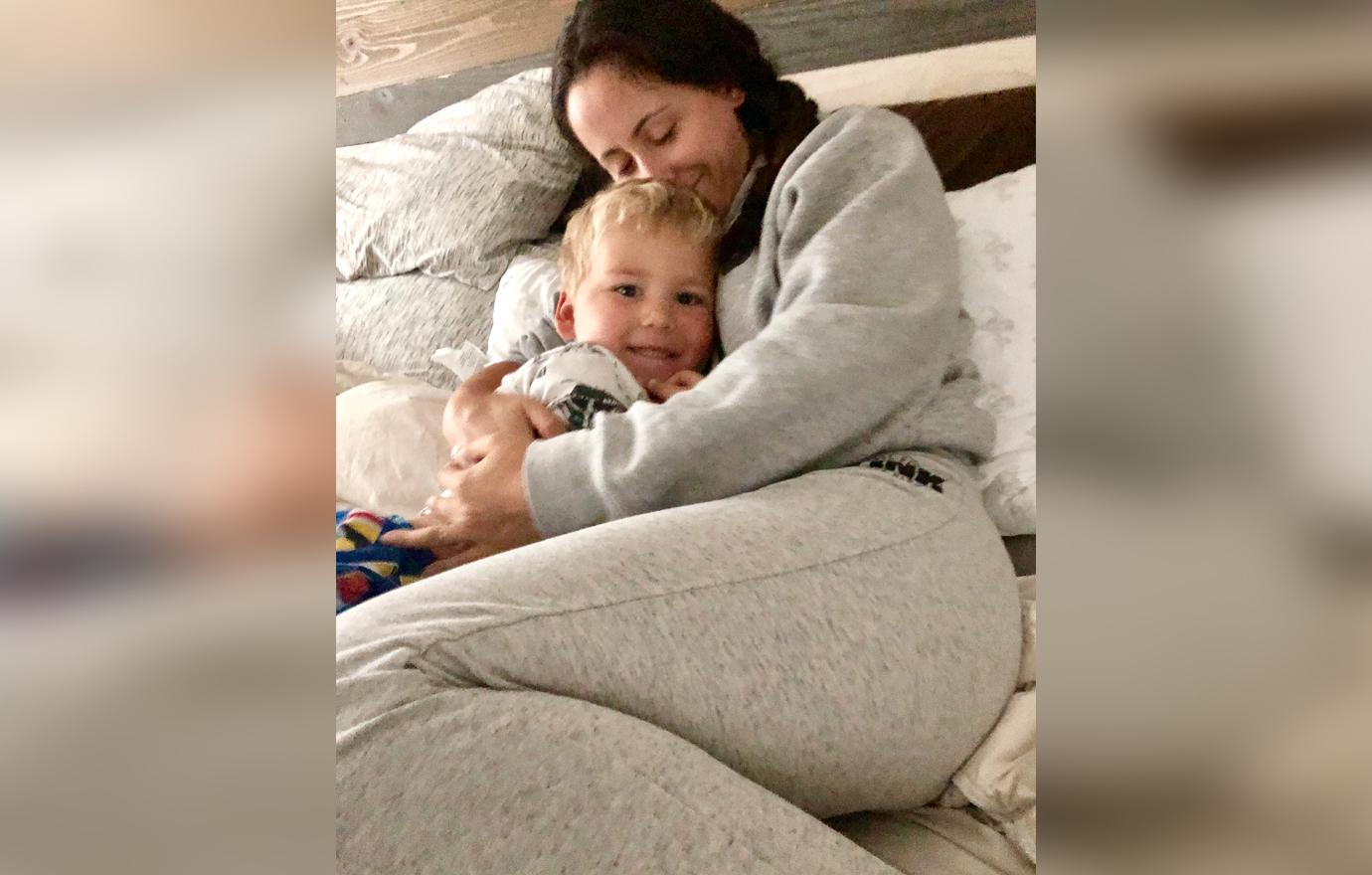 Jenelle Evans Laying in Bed Holding and Smiling Son Kaiser