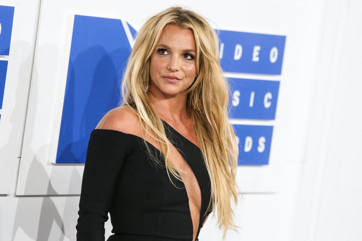Sources said Britney Spears was contacted by police after photos showed her standing through a moving vehicle's sunroof.