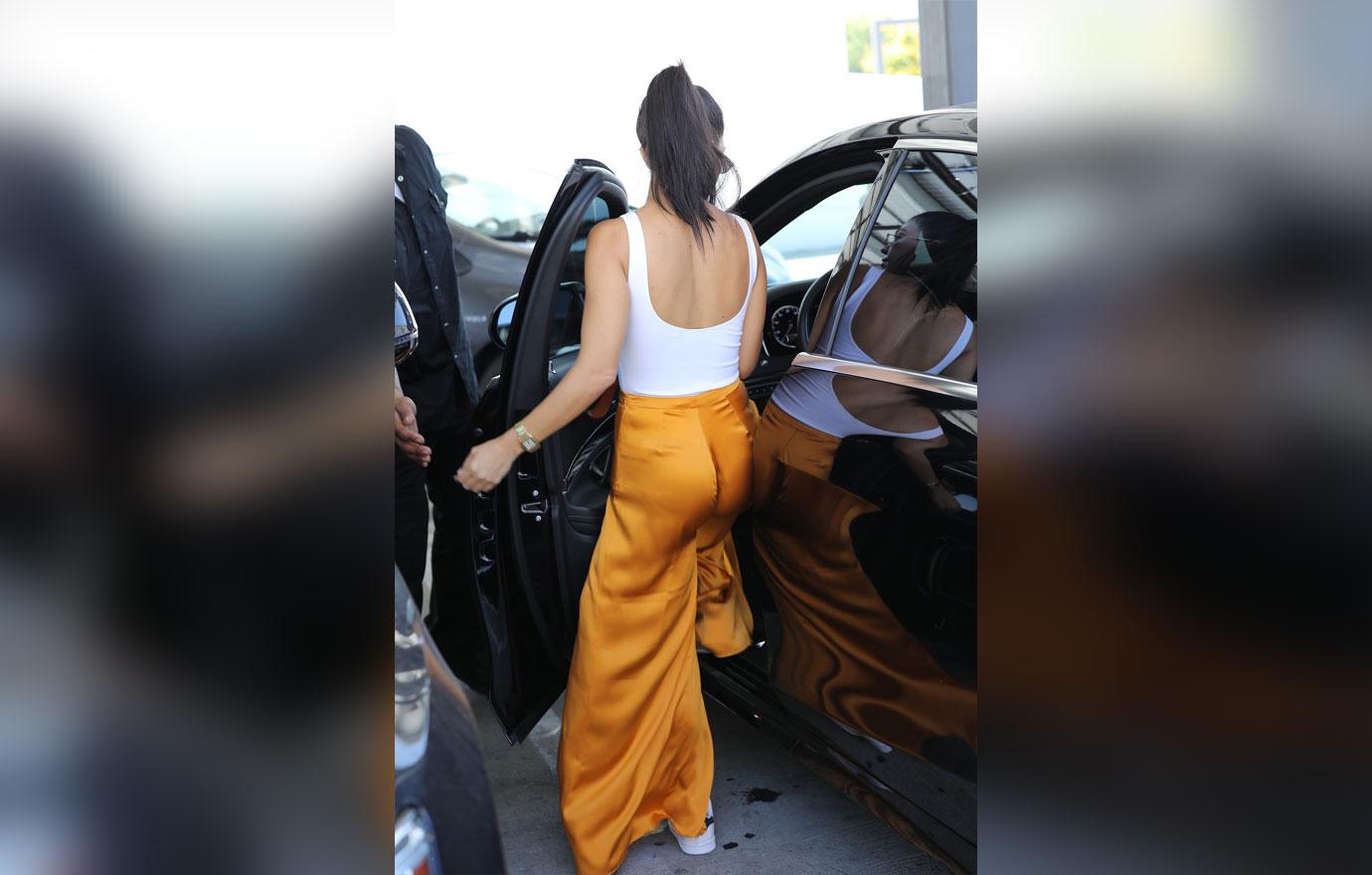 Kourtney Kardashian Goes Braless Yellow Pants