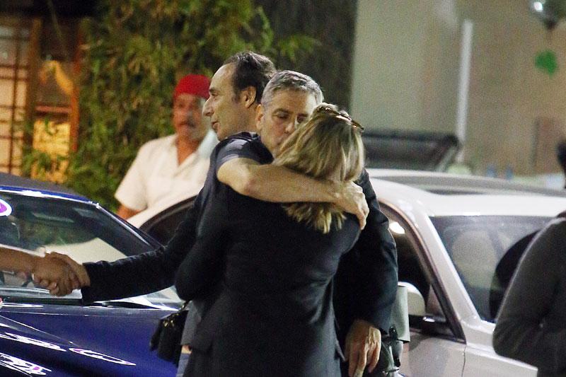 //george clooney kissing mystery woman blonde