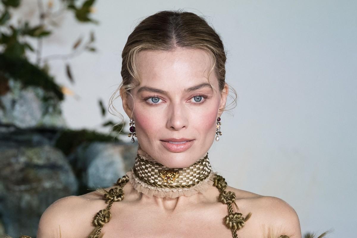 A source said Robbie is signaling her 'Barbie' era is over following her Paris fashion show appearance.