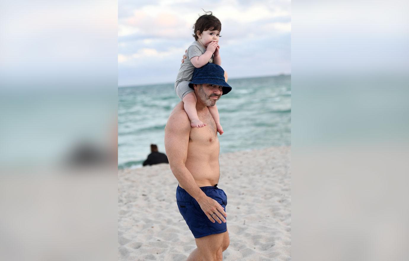 Andy Cohen Looks Buff On Beach With Baby Son