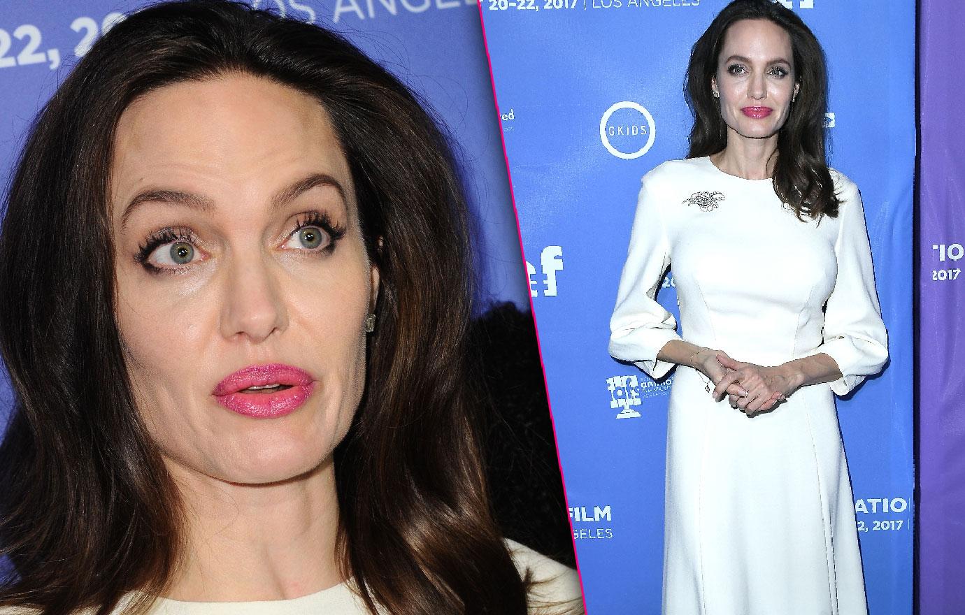 //angelina jolie scary skinny in white gown red carpet premiere