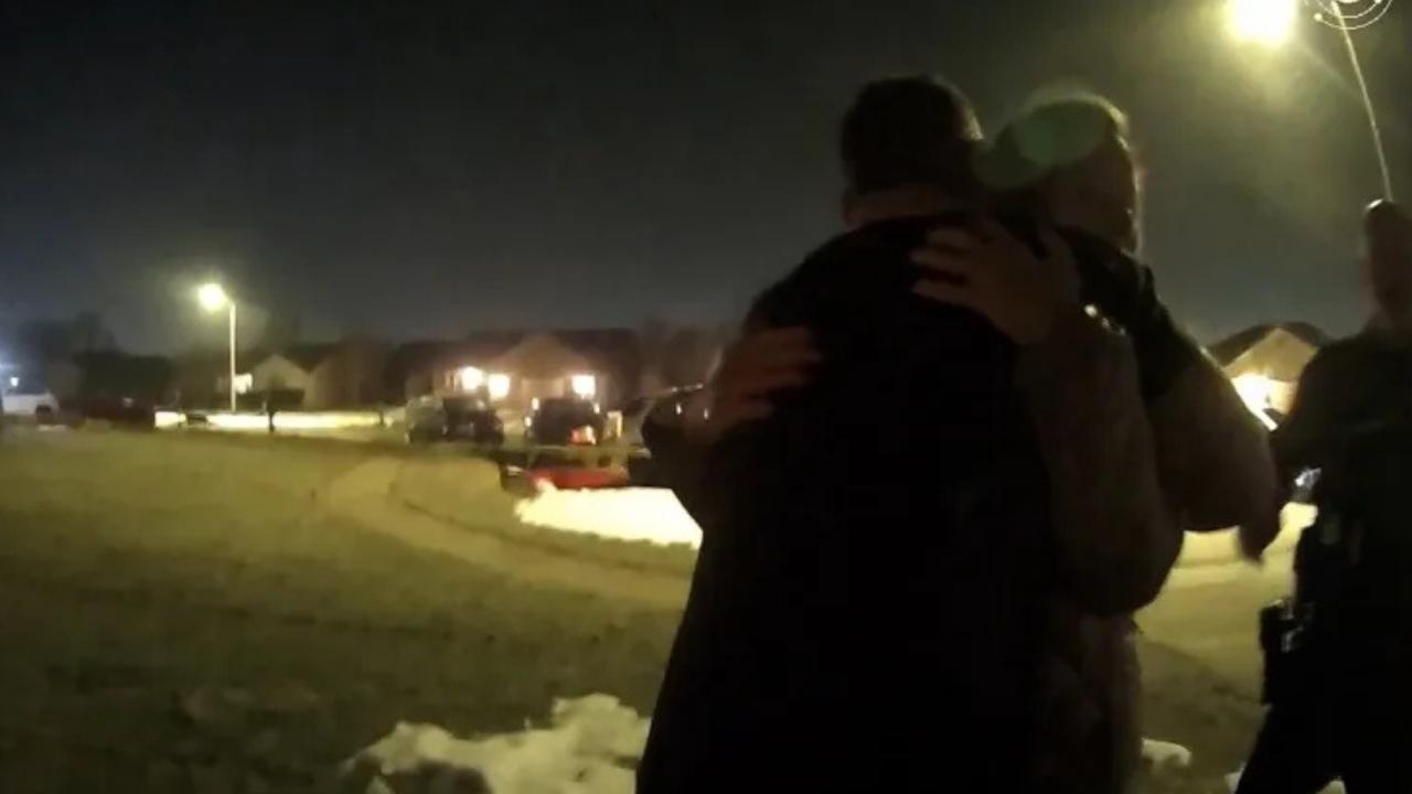 Caleb Flynn hugging his wife's mother after she was killed.