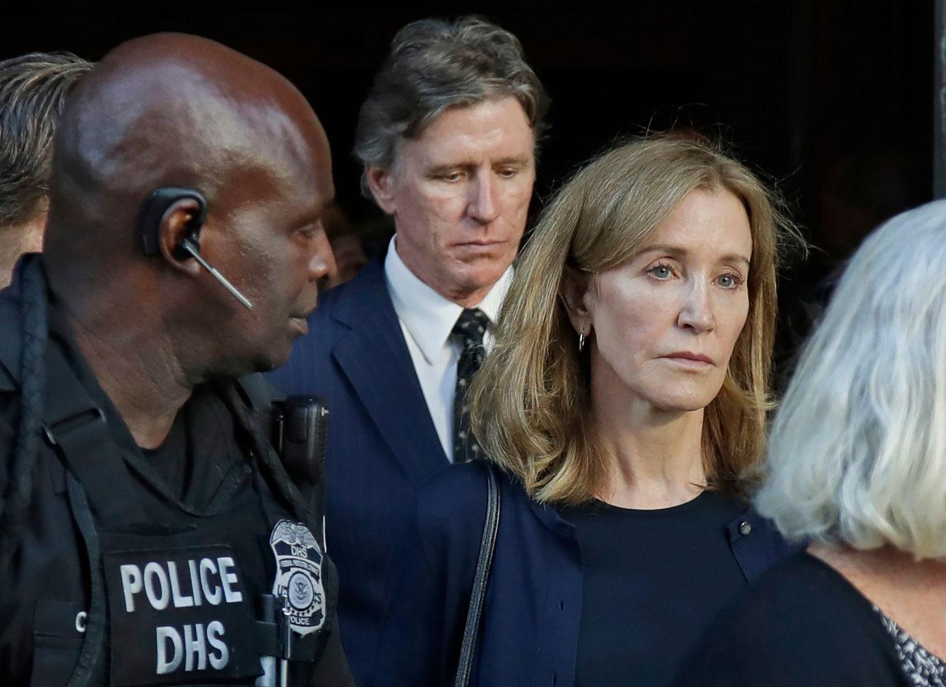 Felicity Huffman leaves federal court with her husband William H. Macy after she was sentenced in a nationwide college admissions bribery scandal, in Boston