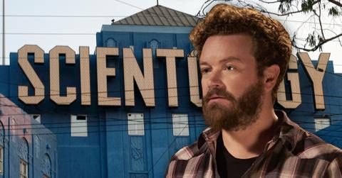 Danny Masterson Looking Serious In Front Of Blue Church With Large Scientology Lettering