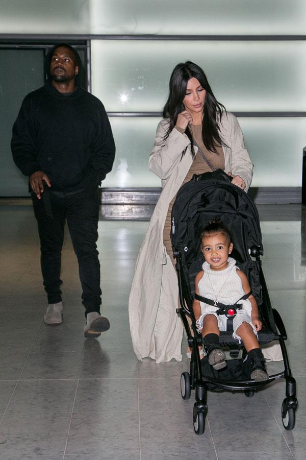 Kim Kardashian Kanye North West Photos -- Toddler Smiles As Family Arrives In Paris