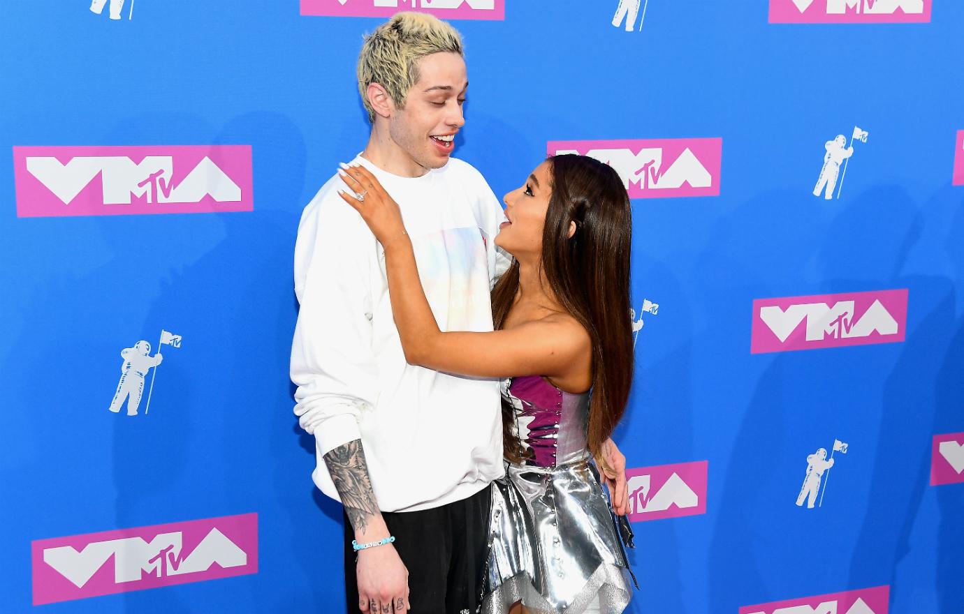 Pete Davidson and Ariana Grande are all smiles and PDA in this sweet pic.