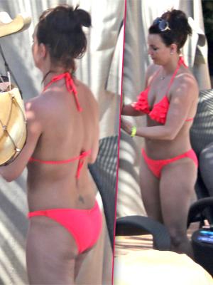 Kim Kardashian bares her butt in pink thong bikini