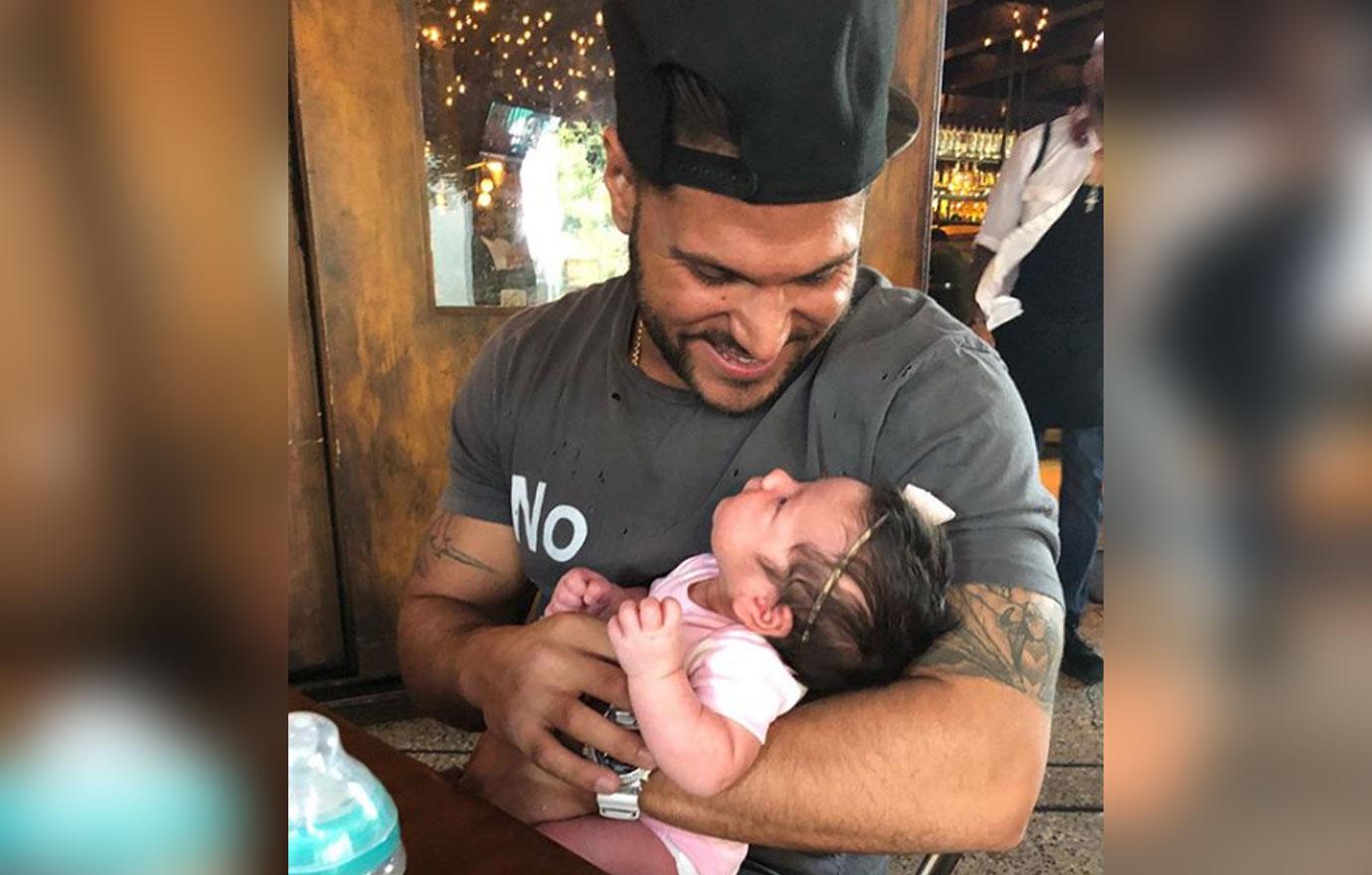 Ronnie Magro Ortiz looks at his baby.