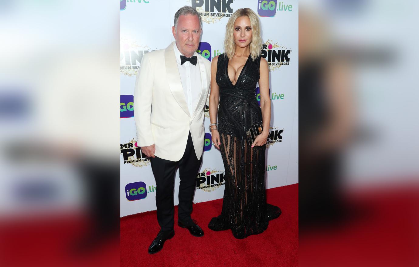 Paul Kemsley Wears a White Tux and Dorit Kemsley Wears a Black Deep V Neck Sequin Dress Looking Serious on The Red Carpet