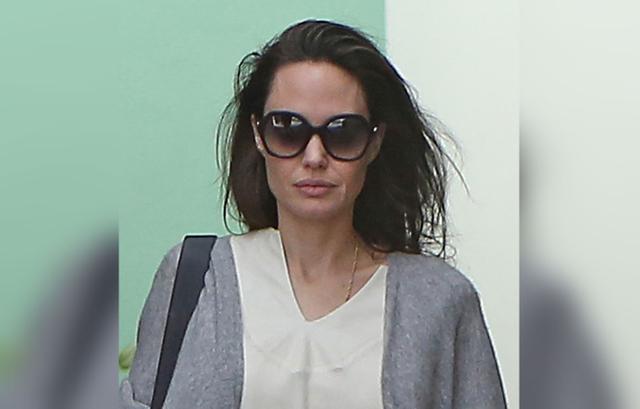 Angelina Jolie Shows Off Skinny Arms As She Sips On Diet Drink