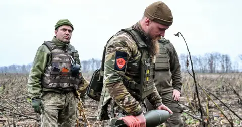 vladimir putin troops decapitate ukrainian soldier place head spike video jpg