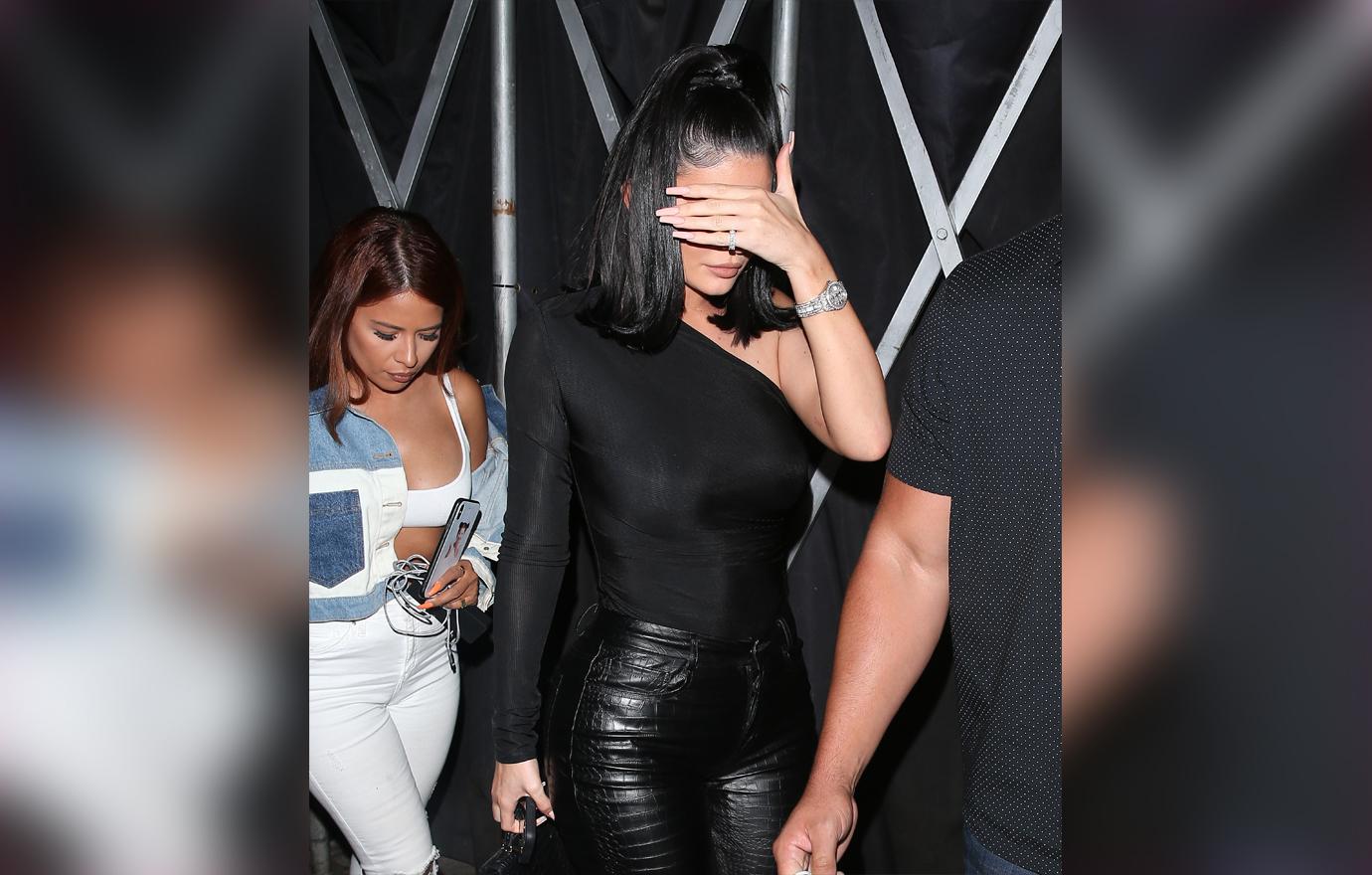 Kylie Jenner in All Black Covering Face