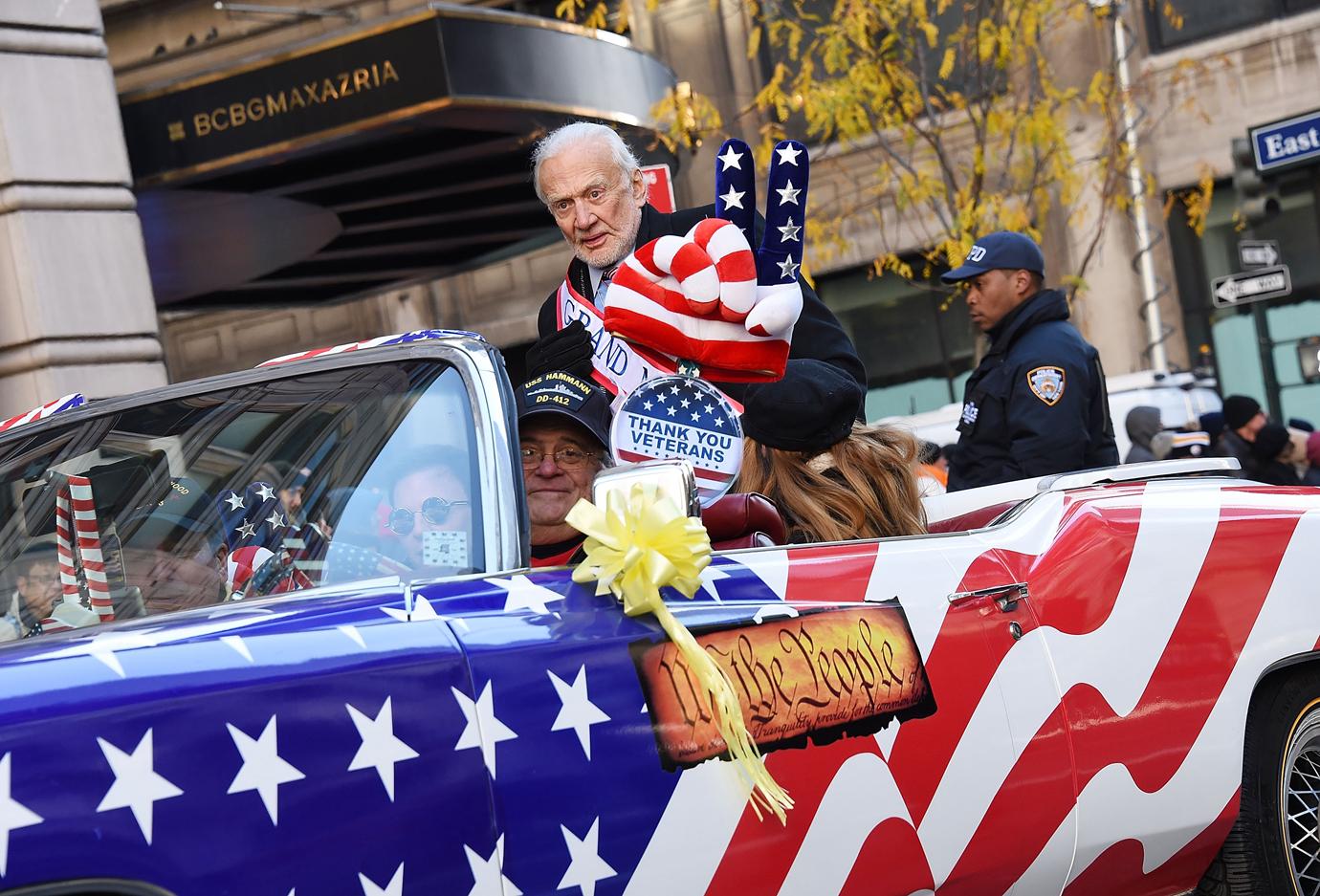 Astronaut and this year's Parade Grand Marshal Buzz Aldrin drives up Fifth Avenue in a convertible during the Veterans Day Parade on November 11, 2017 in New York City.