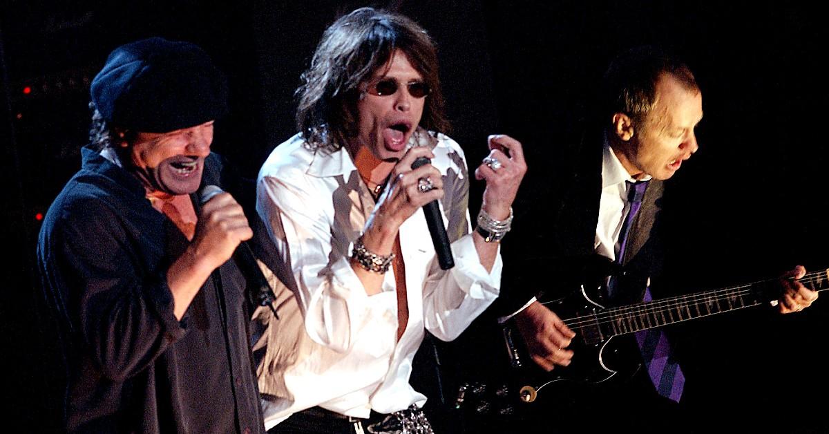 Photo of Steven Tyler playing with AC?DC.