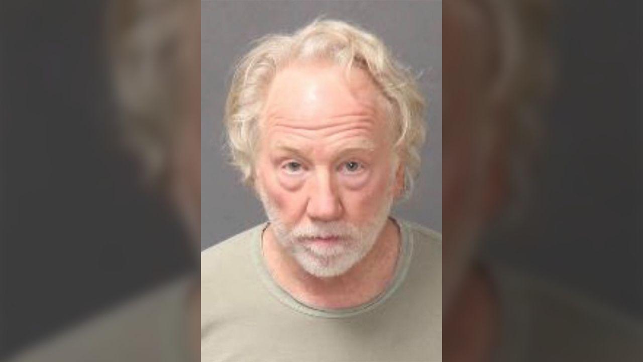A mug shot of Timothy Busfield