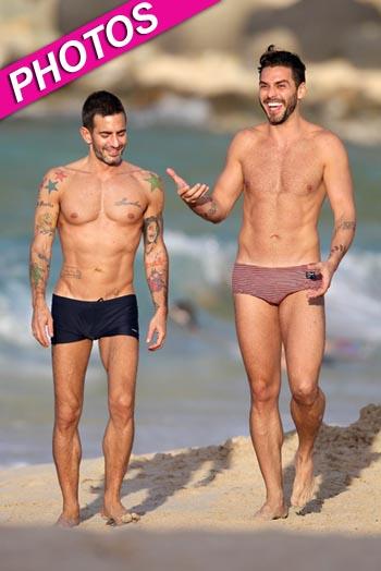 Marc Jacobs' ex-fiance Lorenzo Martone sports Louis Vuitton trunks and  matching towel as he stretches on the beach