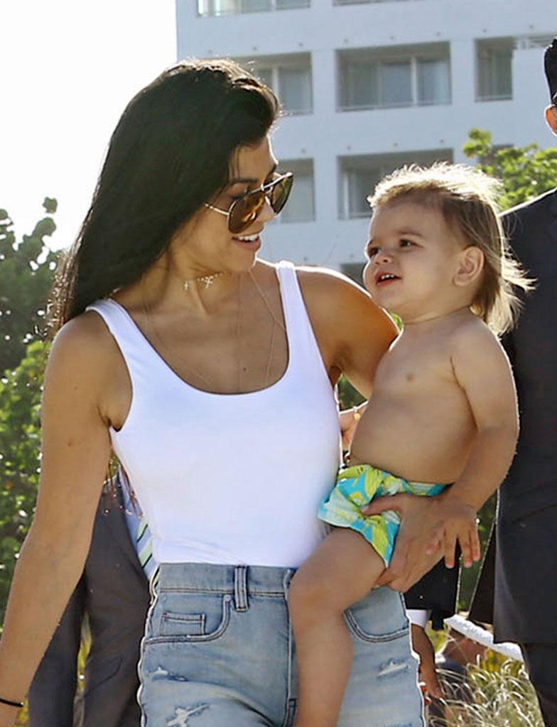 //kourtney kardashian swimsuit pool kids baby reign