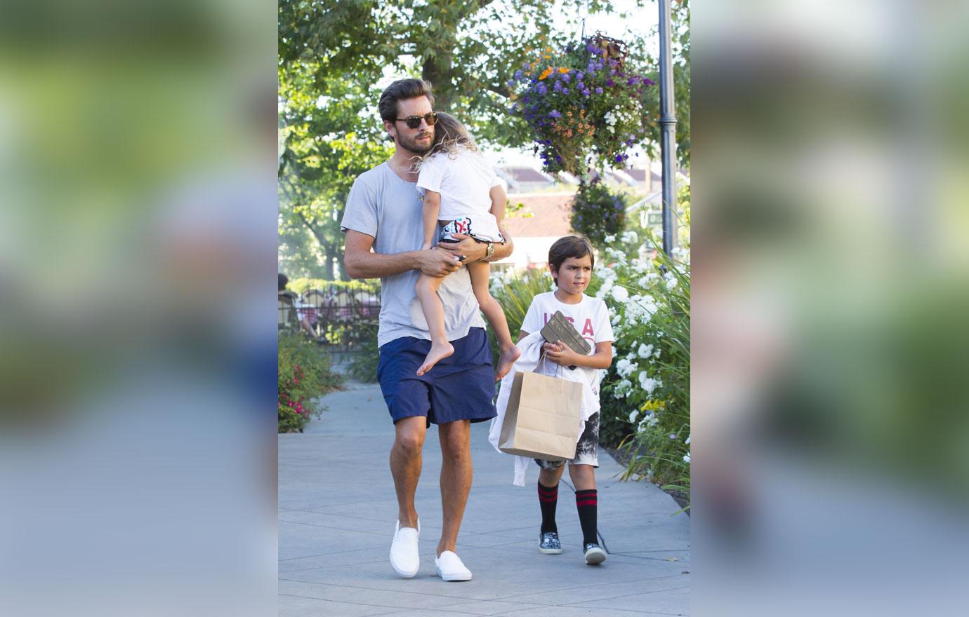 Scott disick carries sleepy penelope family dinner