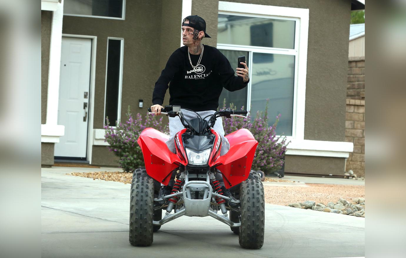 Troubled star Aaron Carter takes a ATV for a ride while sporting his new facial tattoo.