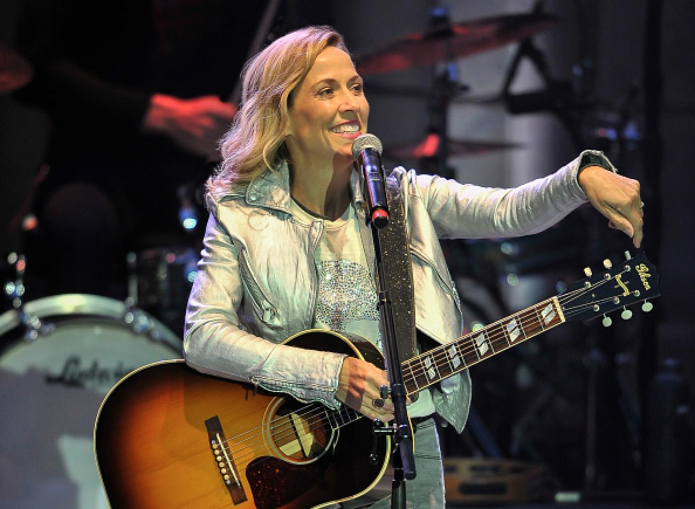 Sheryl Crow performs on stage.