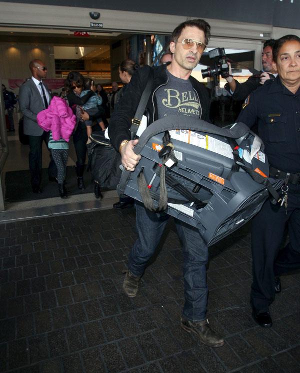 //olivier martinez pushes airport worker