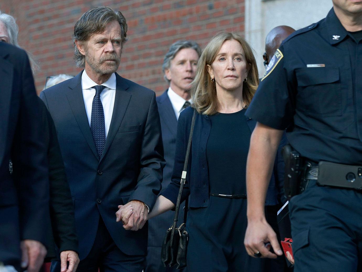 Felicity Huffman leaves federal court with her husband William H. Macy after she was sentenced in a nationwide college admissions bribery scandal, in Boston