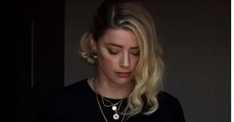 amber heard madrid crutches