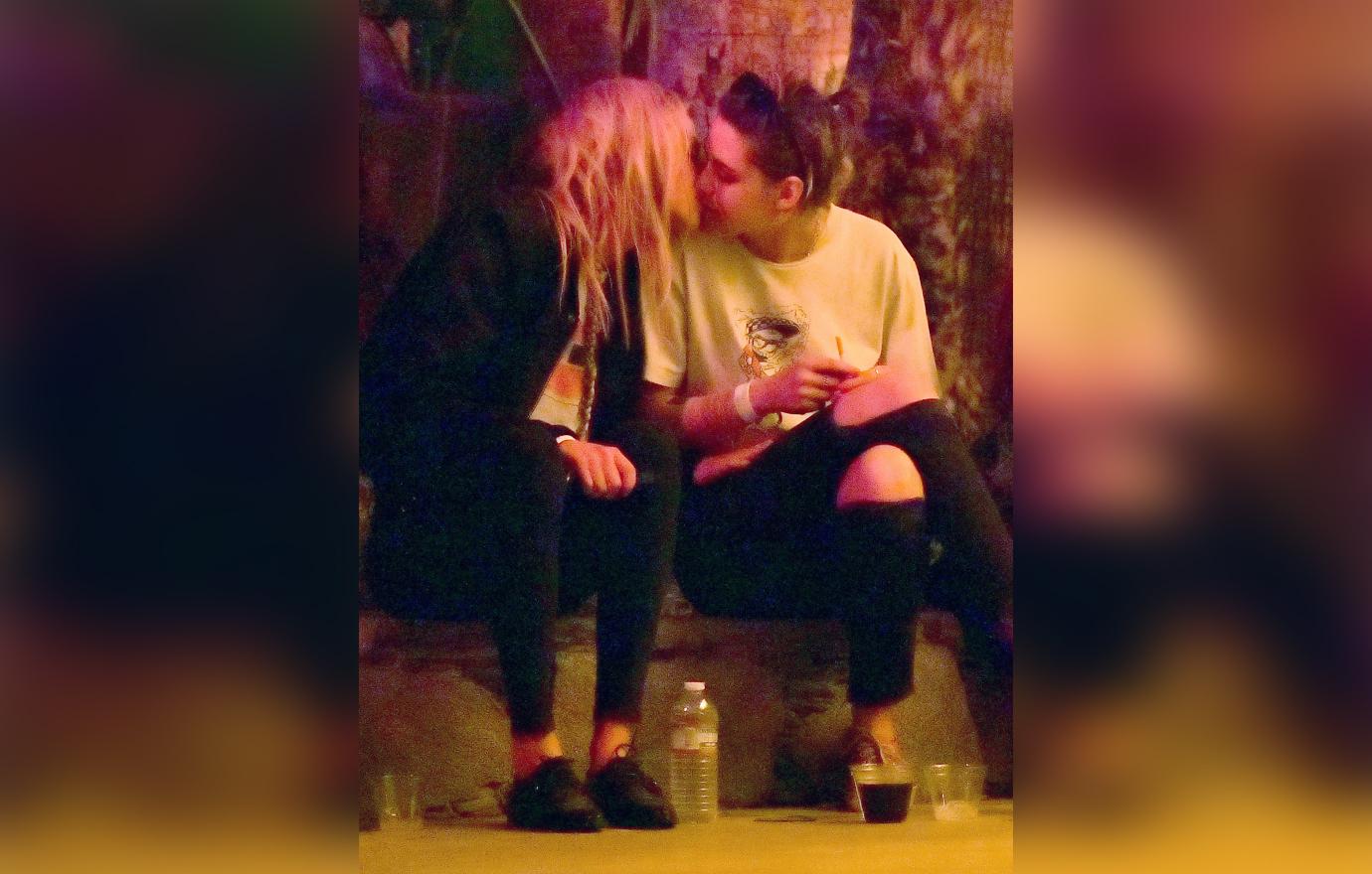 Kristen Stewart and Stella Maxwell Share Kiss Sitting Down Outside at Coachella