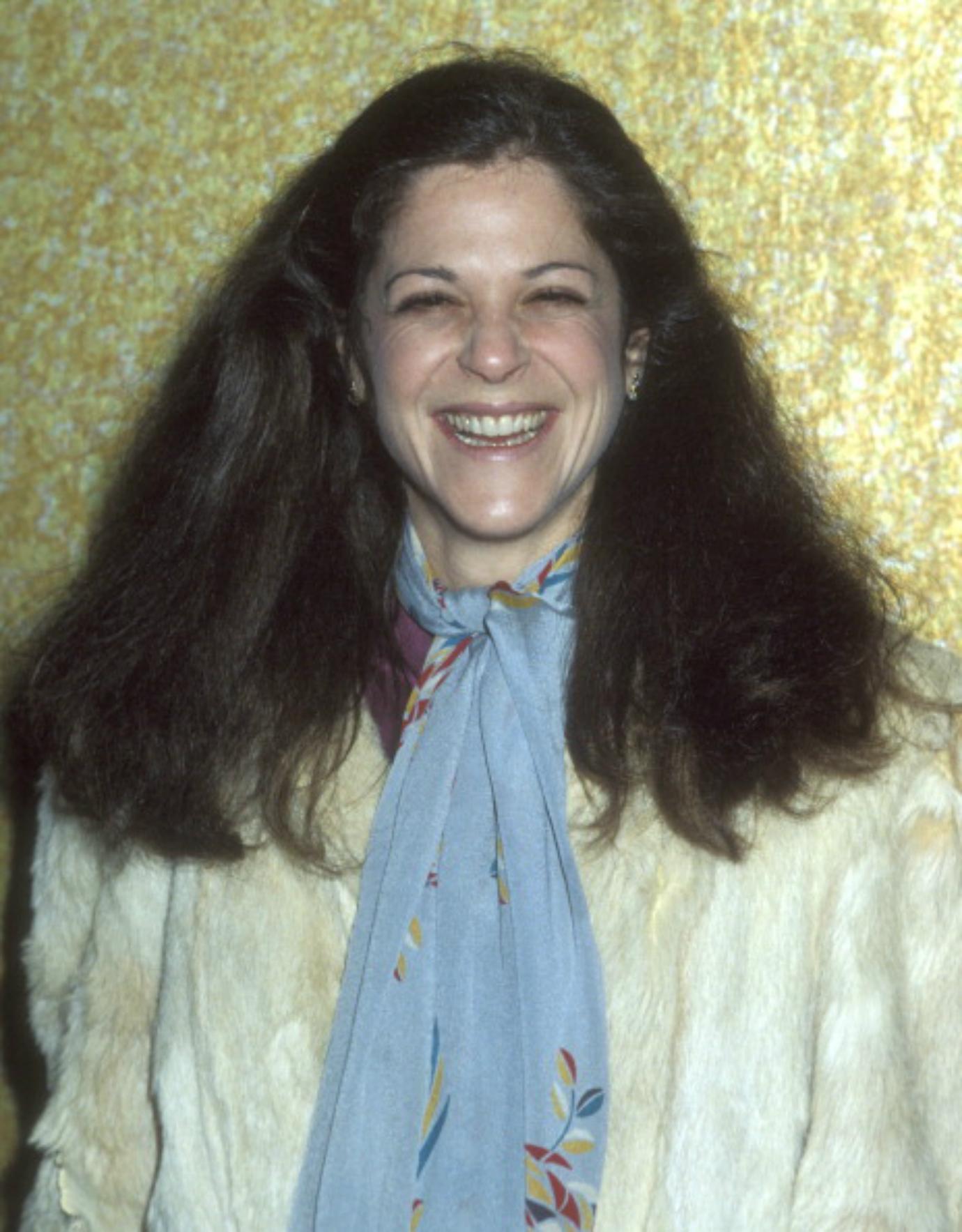 Gilda Radner smiles.