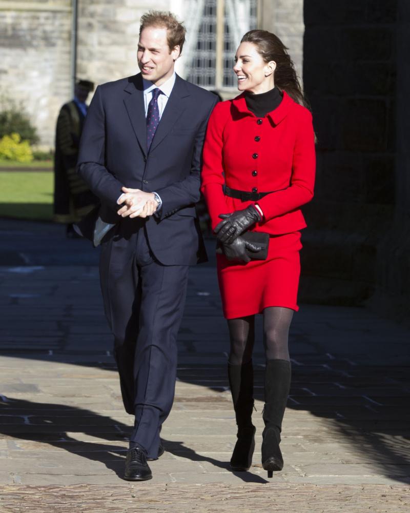 Kate Middleton in a red dress with Prince William