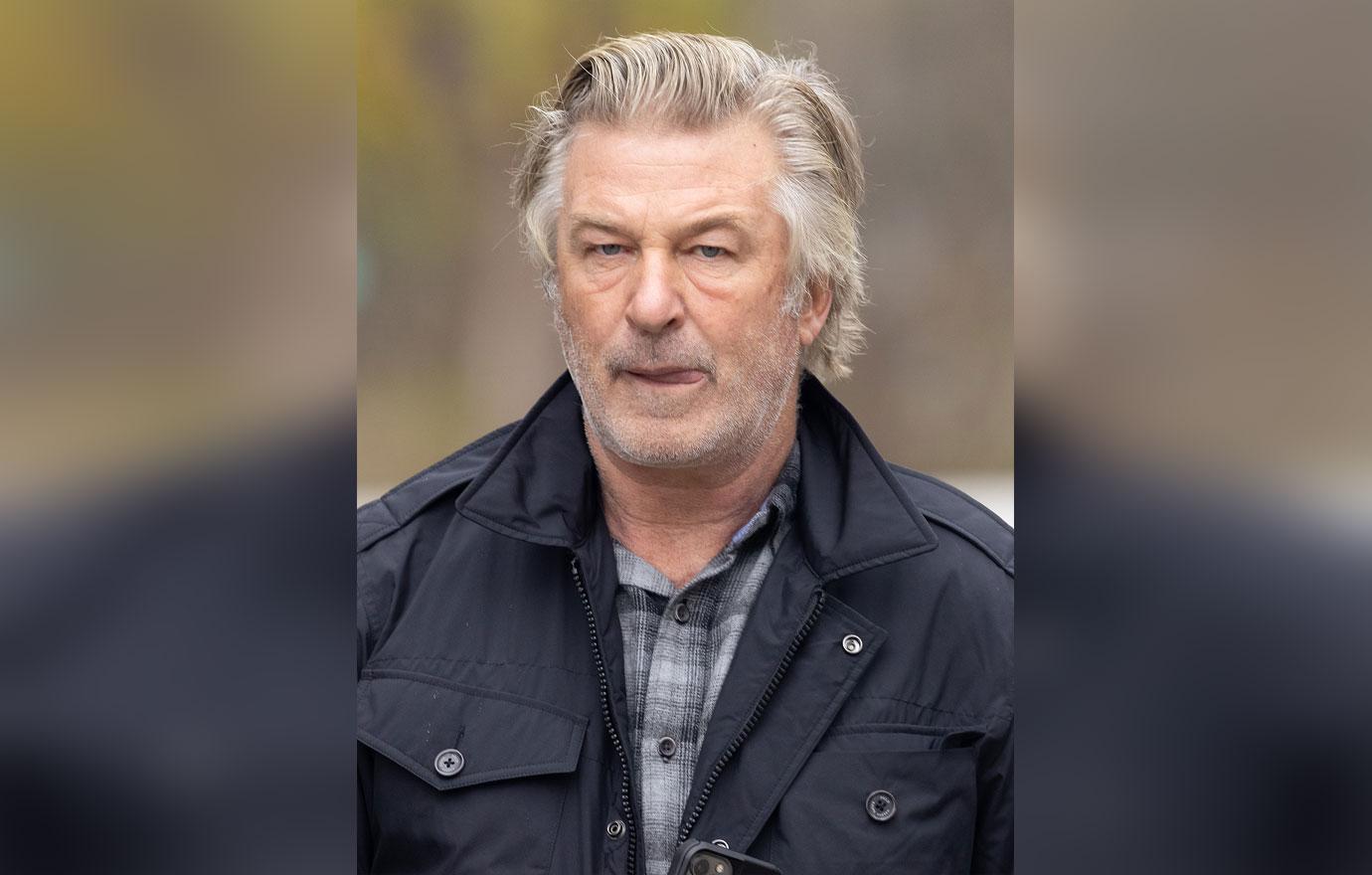 alec baldwin lunges reporter umbrella pulled trigger denial video