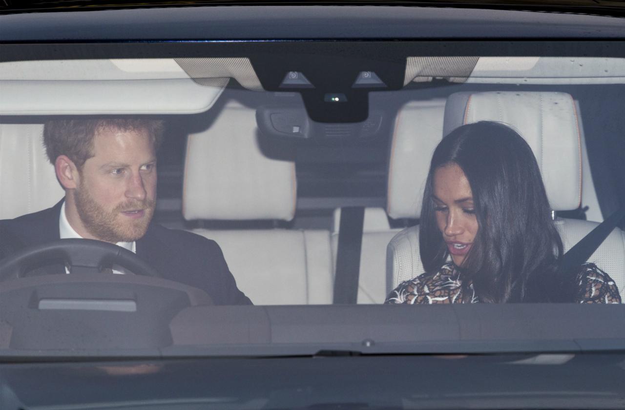 Royal Meghan Markle sitting with Prince Harry in one car