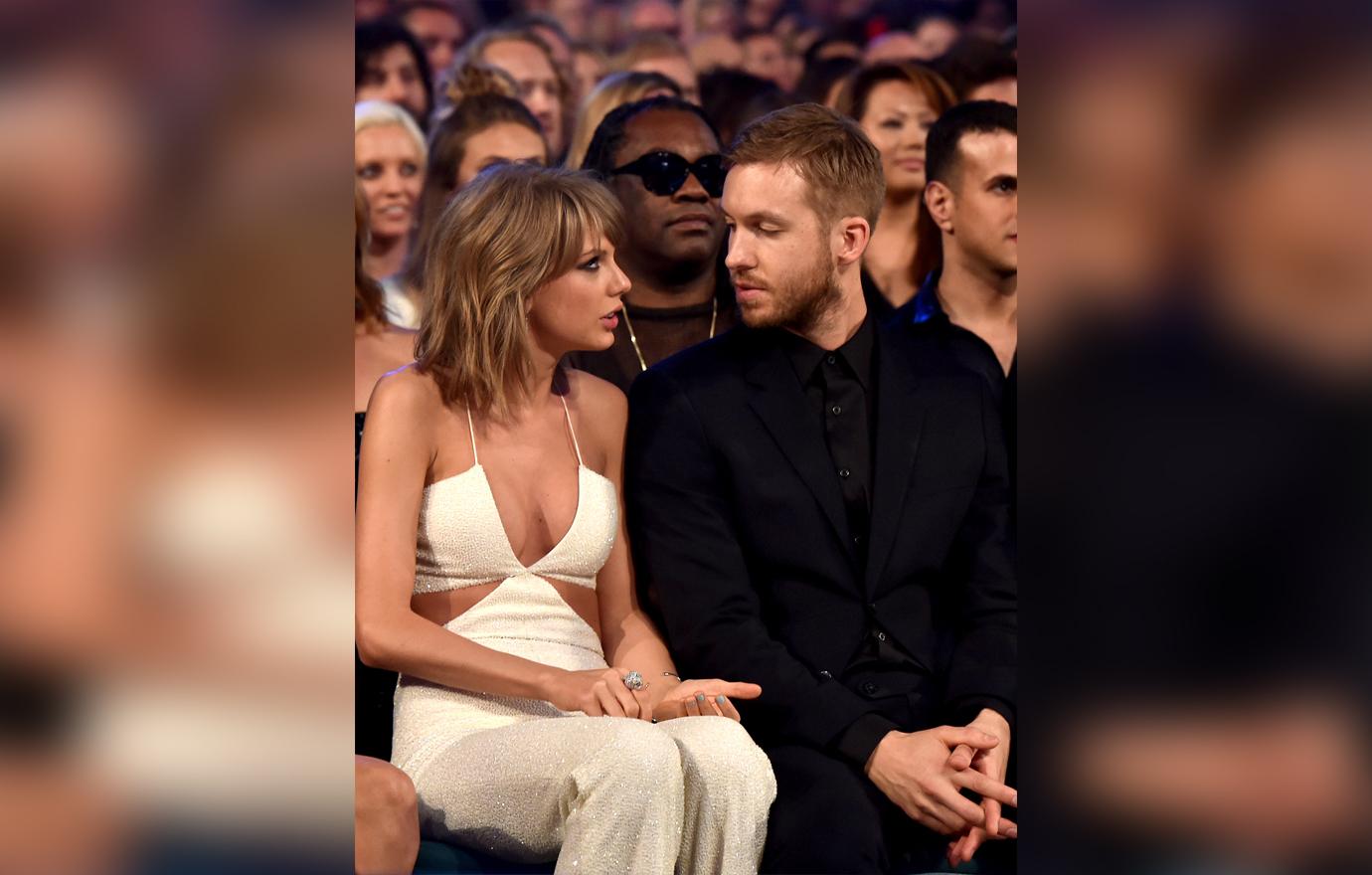 Taylor Swift In White Jumpsuit Sits and Talks To Calvin Harris In A Suit At An Award Show