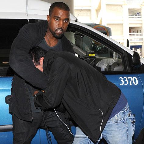 //kanye west photographer scuffle not guilty