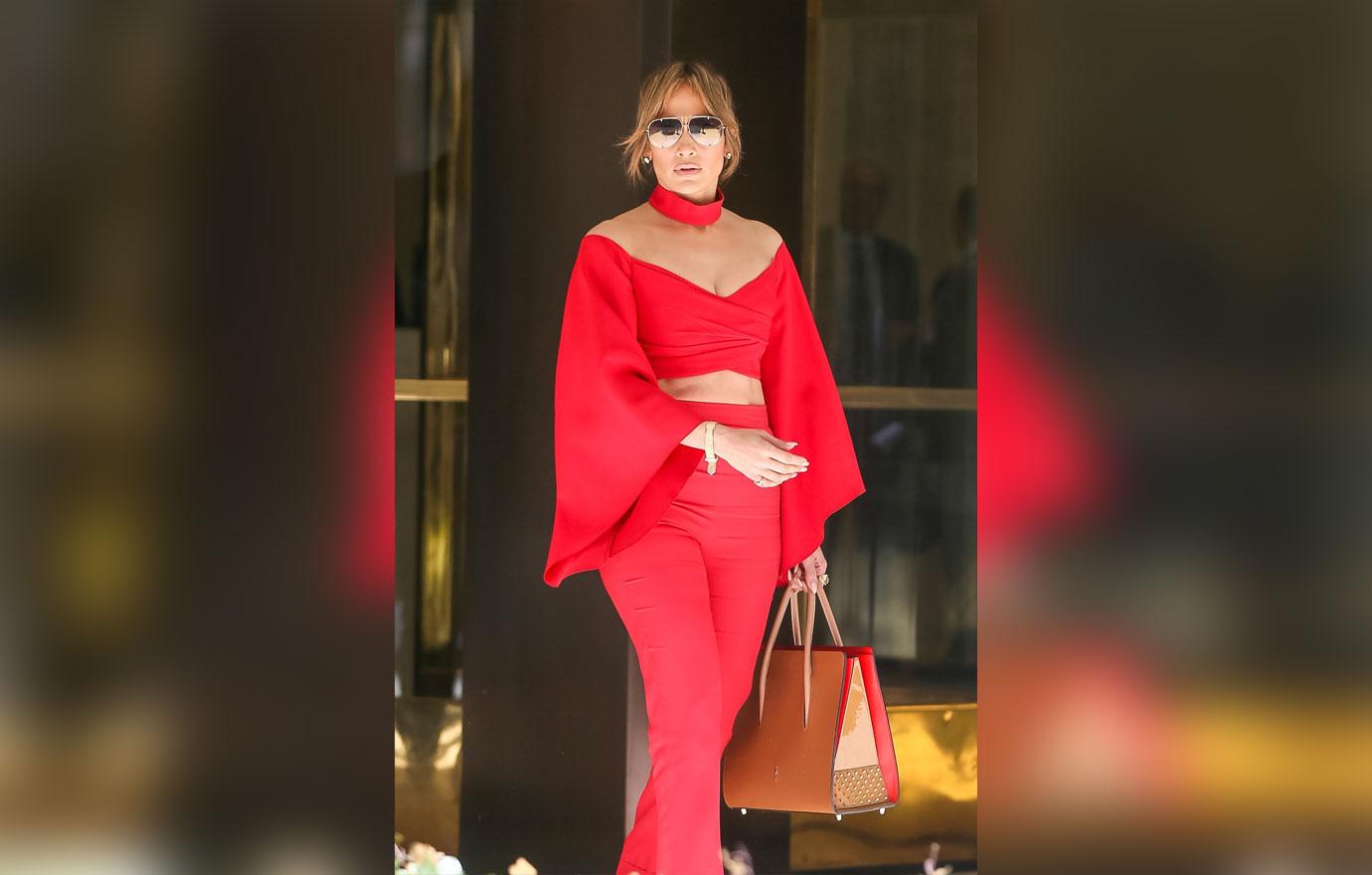 //jennifer lopez alex rodriguez holding arms red shirt boobs pants