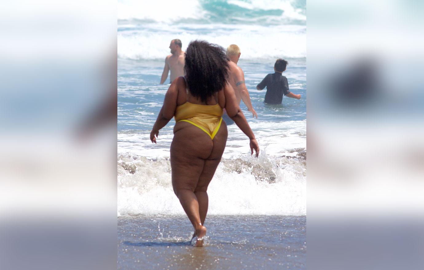 Lizzo Shows Off Curves In Gold Bikini During Beach Day: Photos